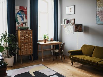 Sunlight streaming through a window onto a wooden floor.